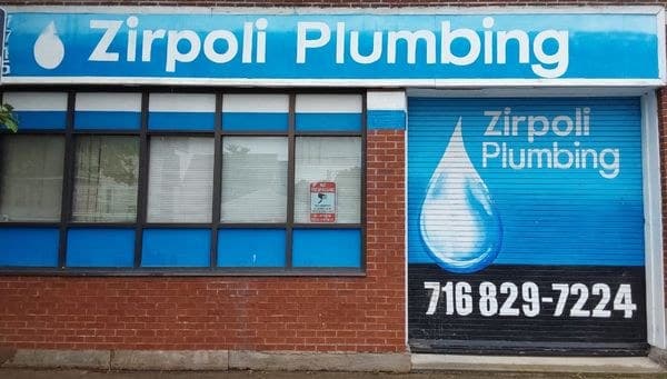 Zirpoli Plumbing storefront at 1715 South Park Avenue, brick with a blue sign